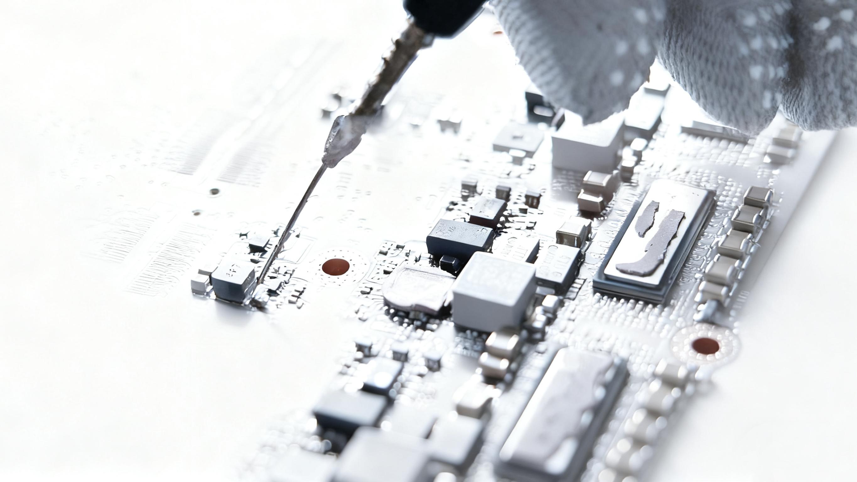 Certified engineer performing precision chip-level PCB repair
