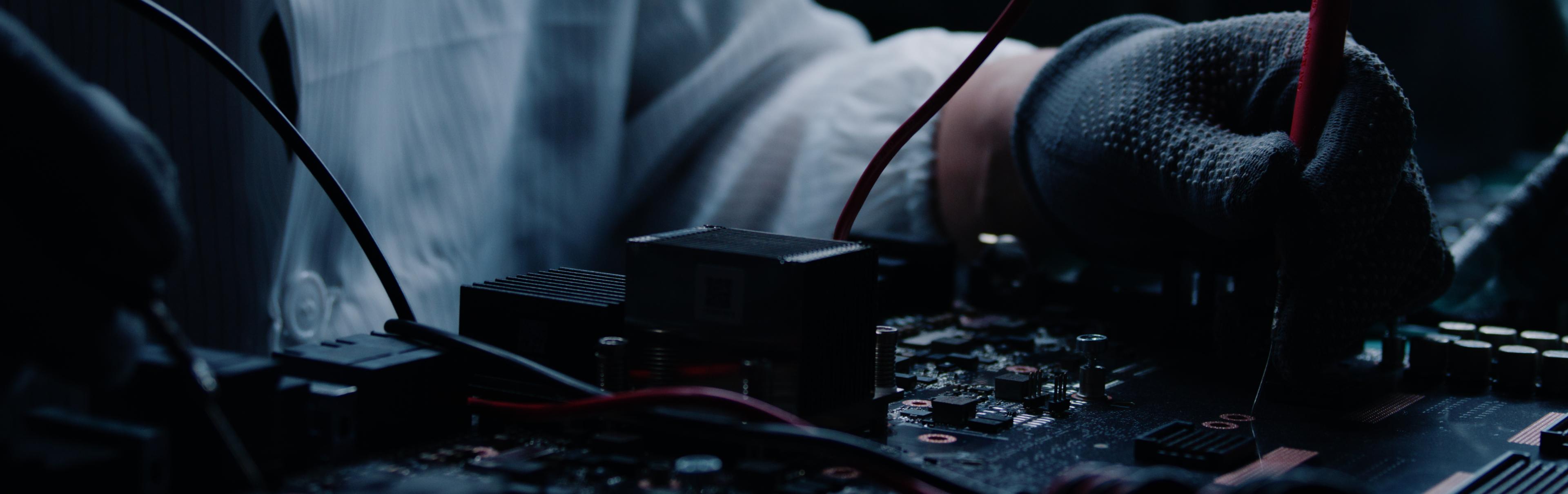 Engineer testing GPU server board at Vertex Infrastructure Services repair facility